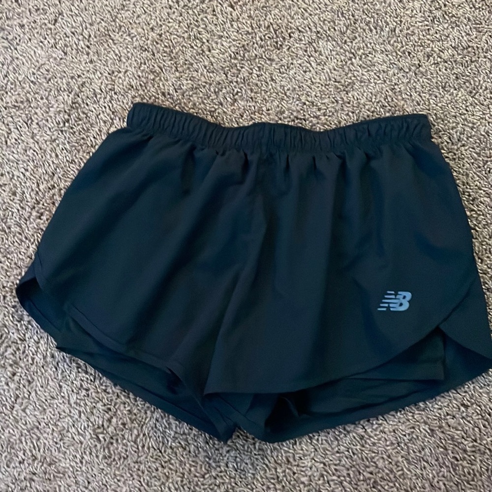 Black new balance running shorts. Has built in spandex’s.